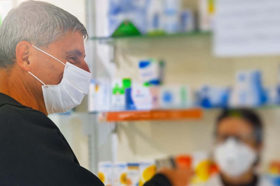 Wearing a face covering in a pharmacy