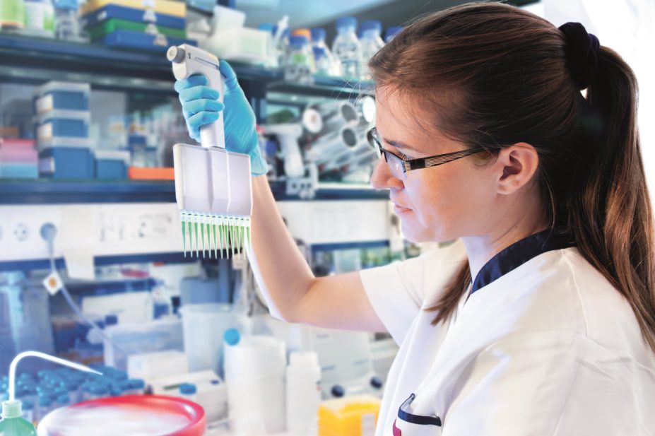 Developing a lasting research culture within pharmacy could drive improvements throughout the profession in Wales. In the image, a female scientist in a research laboratory