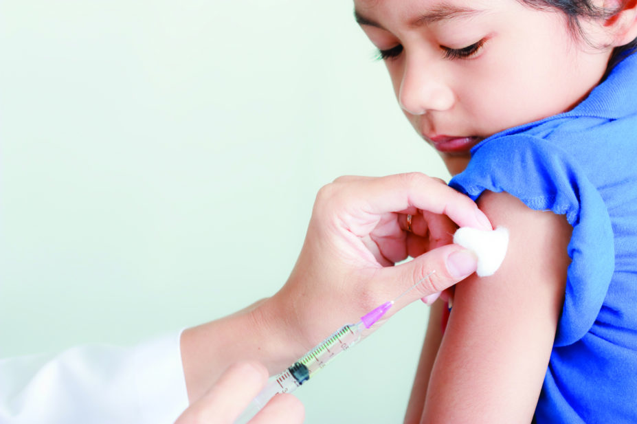 child receiving flu jab
