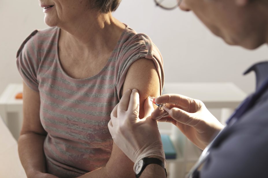Older person receiving flu vaccine