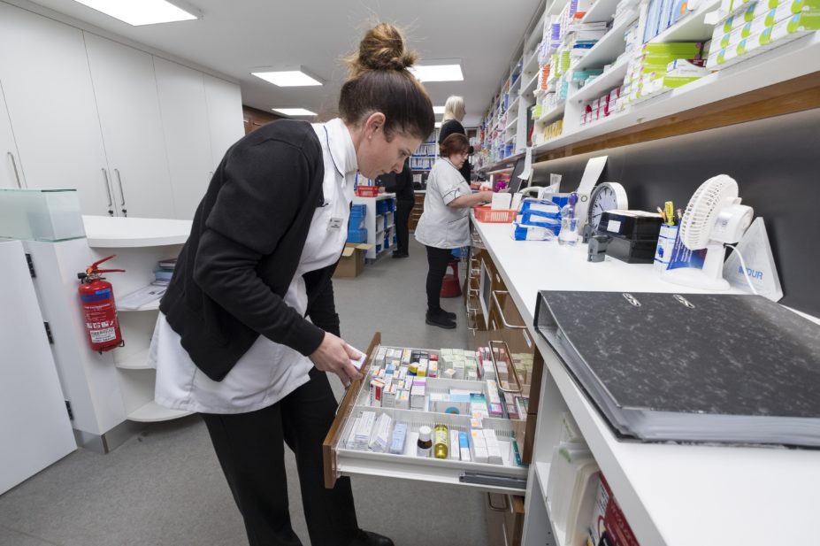 hospital pharmacist preparing prescription