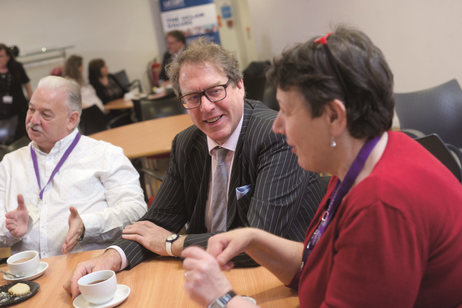 Nigel Clarke, chair of the GPhC, speaks with a member of the UCLan's Comensus group