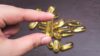 Hand holding fish oil capsule which is rich in omega-3 fatty acids