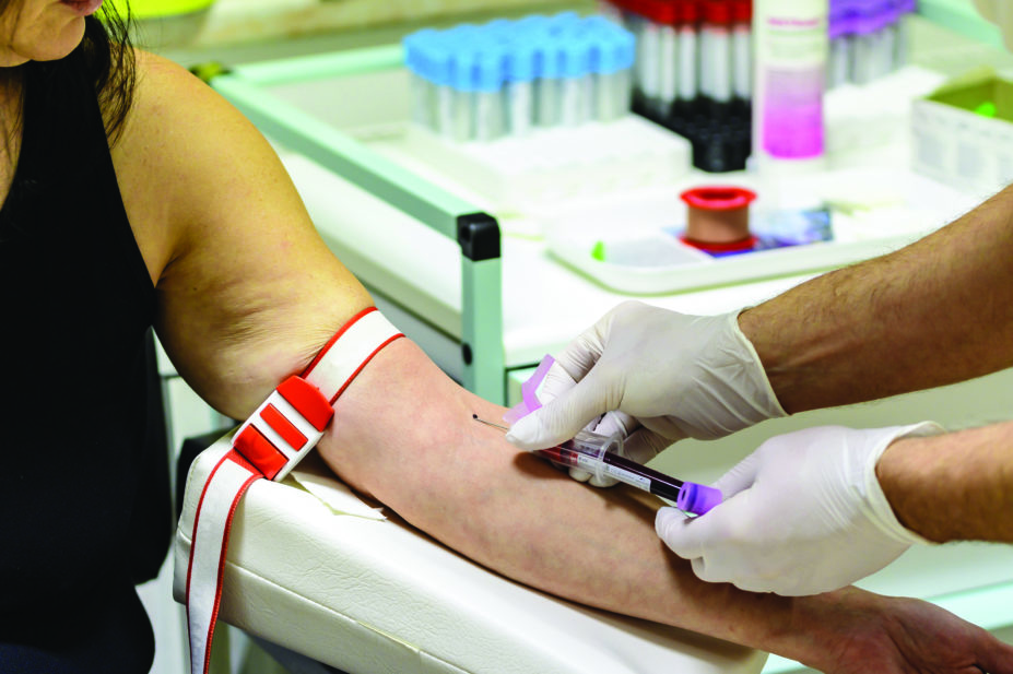 An older woman having blood taken for a HIV test