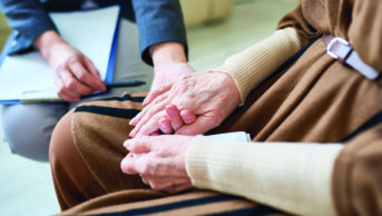 Holding hands, elderly patient
