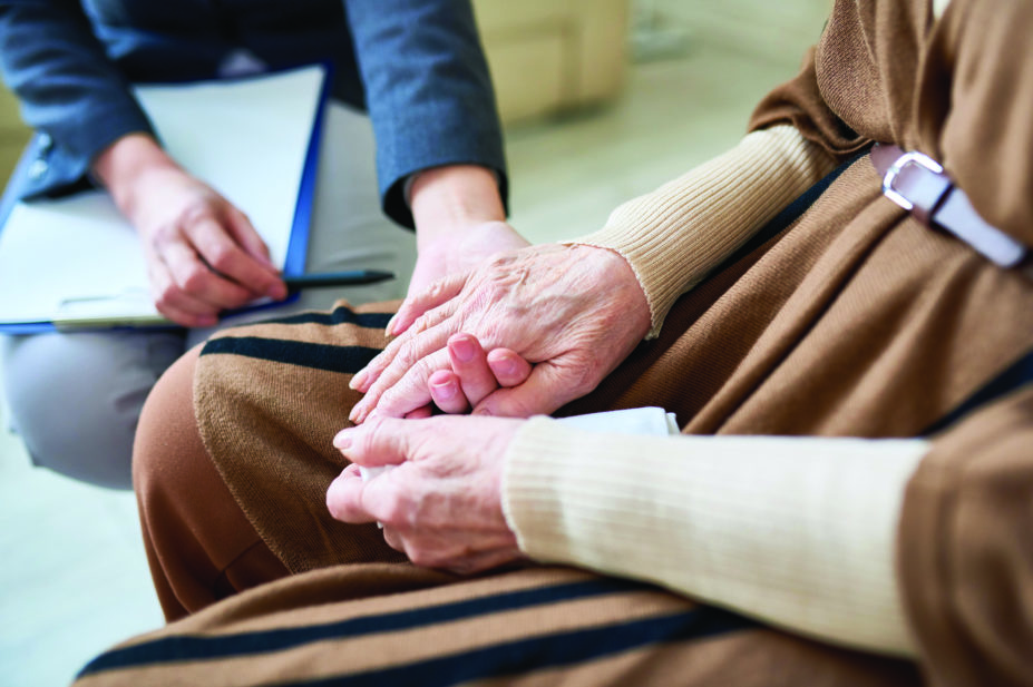 Holding hands, elderly patient