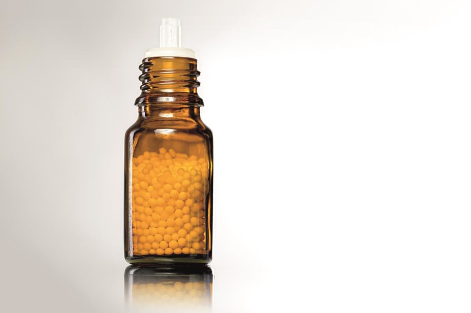 Homeopathy bottle with round pills inside