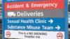Hospital entrance sign showing sexual health clinic
