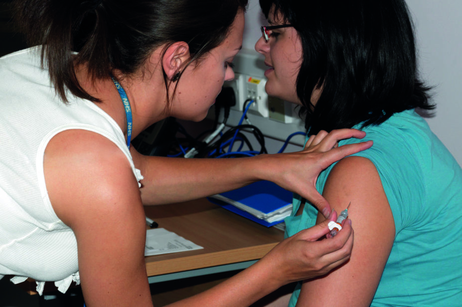 Teenager gets an HPV vaccine injection