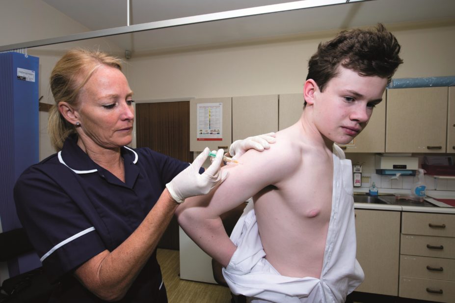 Boy having HPV vaccine