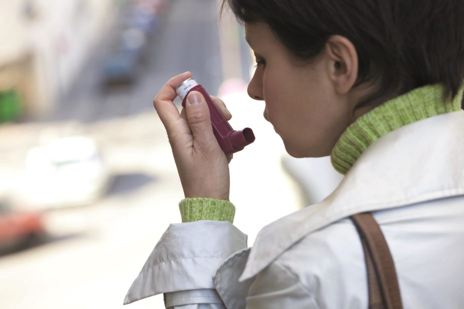 Inhaled corticosteroids (ICS) are a recommended first-line preventative therapy for asthma and long-term use is not linked with bone-density-related adverse effects, such as osteoporosis and fractures. In the image, a woman holds an asthma inhaler