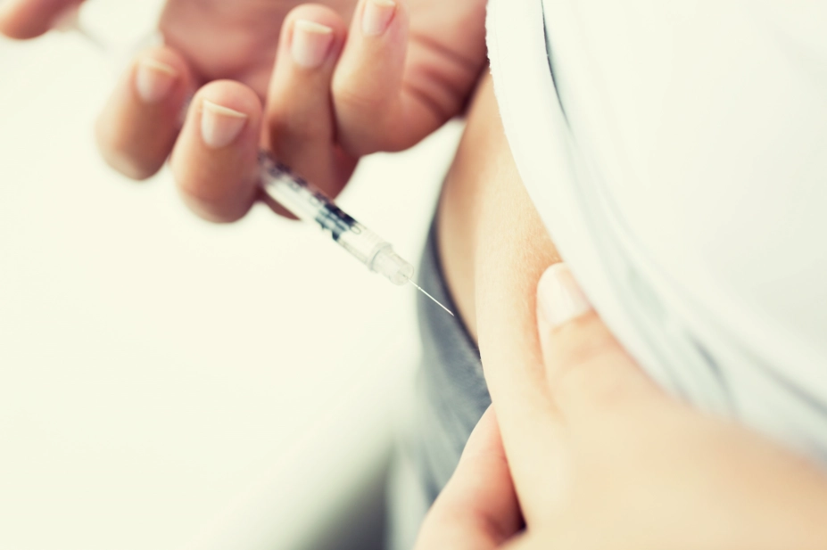 Woman injecting insulin