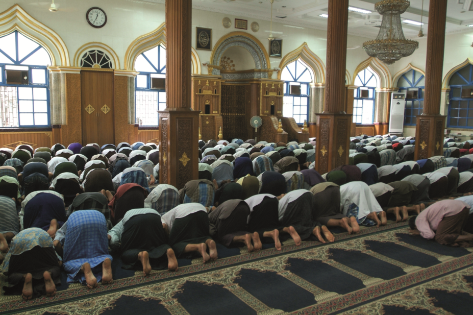 Men praying at a mosque
