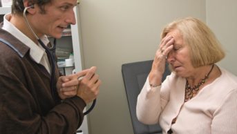 Management of migraines is individualised for each patient and there are a number of evidence and practiced-based treatments available. In the image, an elderly woman with a migraine consults with a doctor