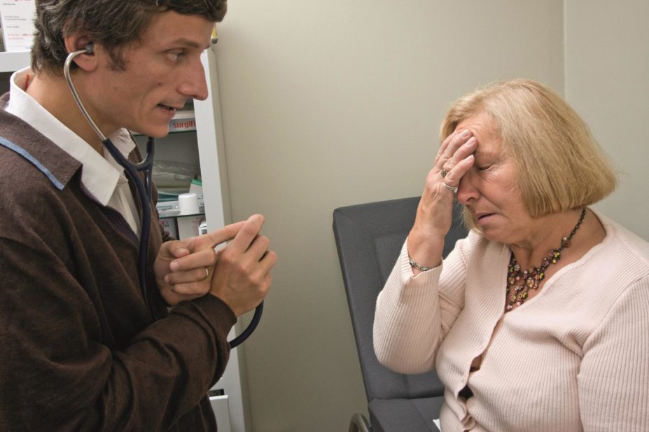 Management of migraines is individualised for each patient and there are a number of evidence and practiced-based treatments available. In the image, an elderly woman with a migraine consults with a doctor