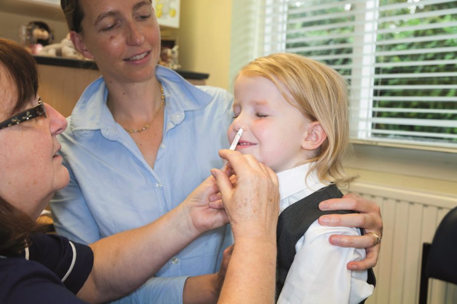 Four year old child receives nasal flu vaccine
