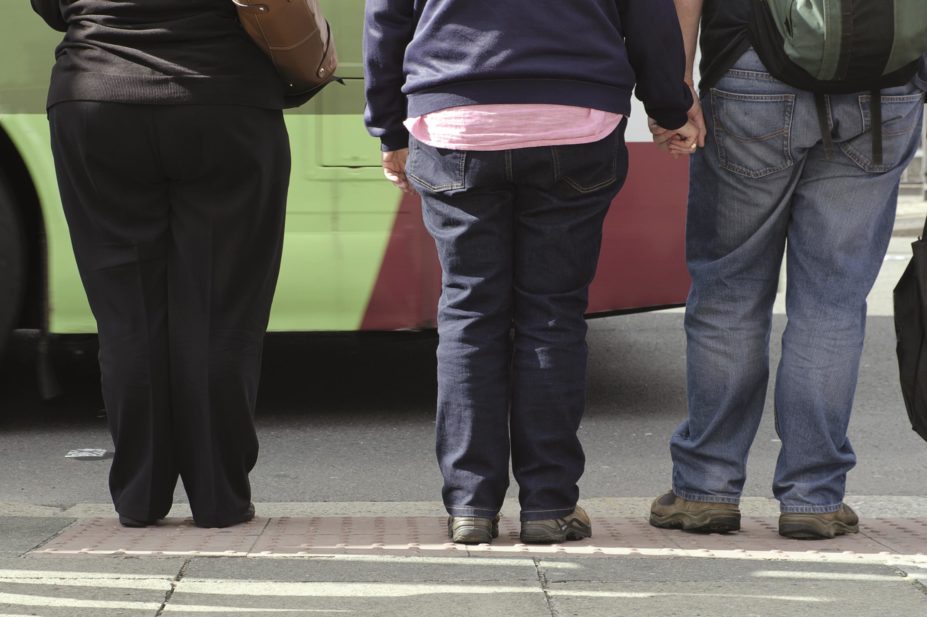 A daily injection of liraglutide can help obese or overweight patients with type 2 diabetes lose weight if they also follow a reduced calorie diet and increase exercise. In the image, a group of overweight people crossing a street