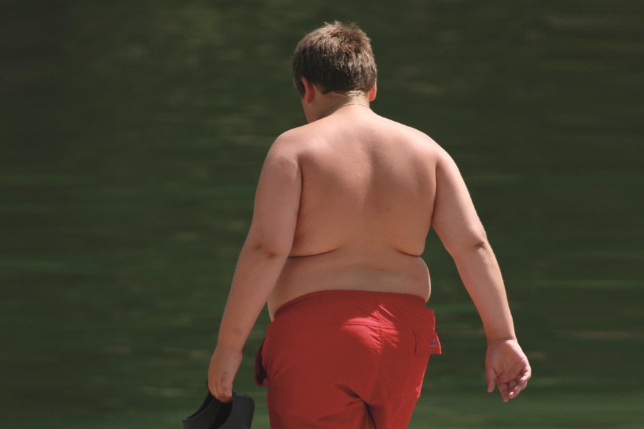 Giving metformin in addition to insulin does not improve glycaemic control in overweight or obese young people with type 1 diabetes, according to research. In the image, the back of a young obese boy