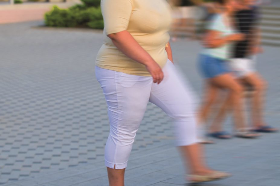 Glucagon-like peptide 1 (GLP-1) receptor agonists are used to treat type 2 diabetes mellitus and one such agent, liraglutide, has recently been approved for use as an anti-obesity drug. In the image, an obese woman walks on the pavement