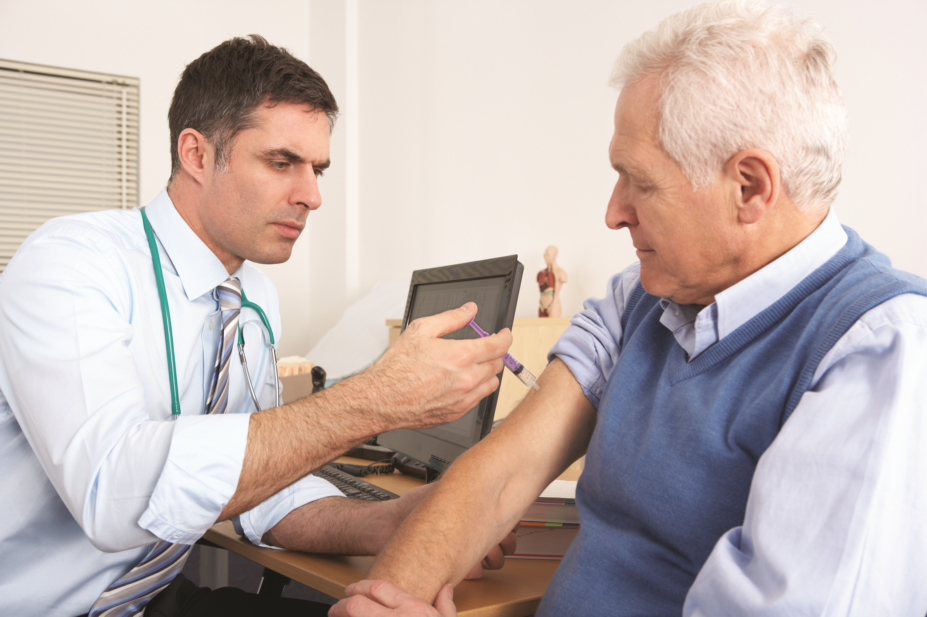 older person receiving flu jab from GP
