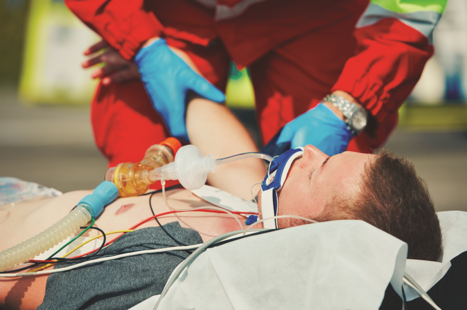 paramedics resuscitating patient