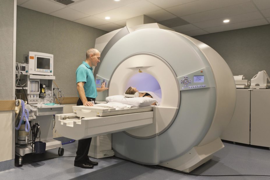 A patient lies in an MRI scanner to get a brain scan