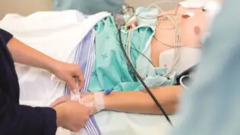 For patients admitted to hospital, the most common cause of preventable death is venous thromboembolism. Researchers found that 36% of high-risk patients were not receiving prophylactic anticoagulation. In the image, a patient on a hospital bed