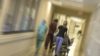 Blurred image of patient being rush by hospital staff to an emergency room