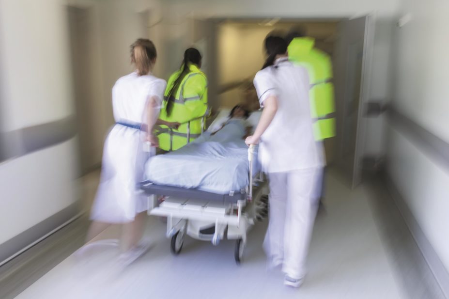 Almost one in ten serious and unexpected drug events are not reported to the US Food and Drug Administration within the required time frame. In the image, a patient on a stretcher is rushed to the hospital emergency