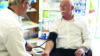 Pharmacist takes the blood pressure of an elderly patient