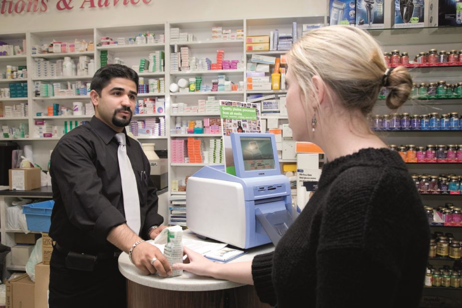 A pharmacist helping a patient