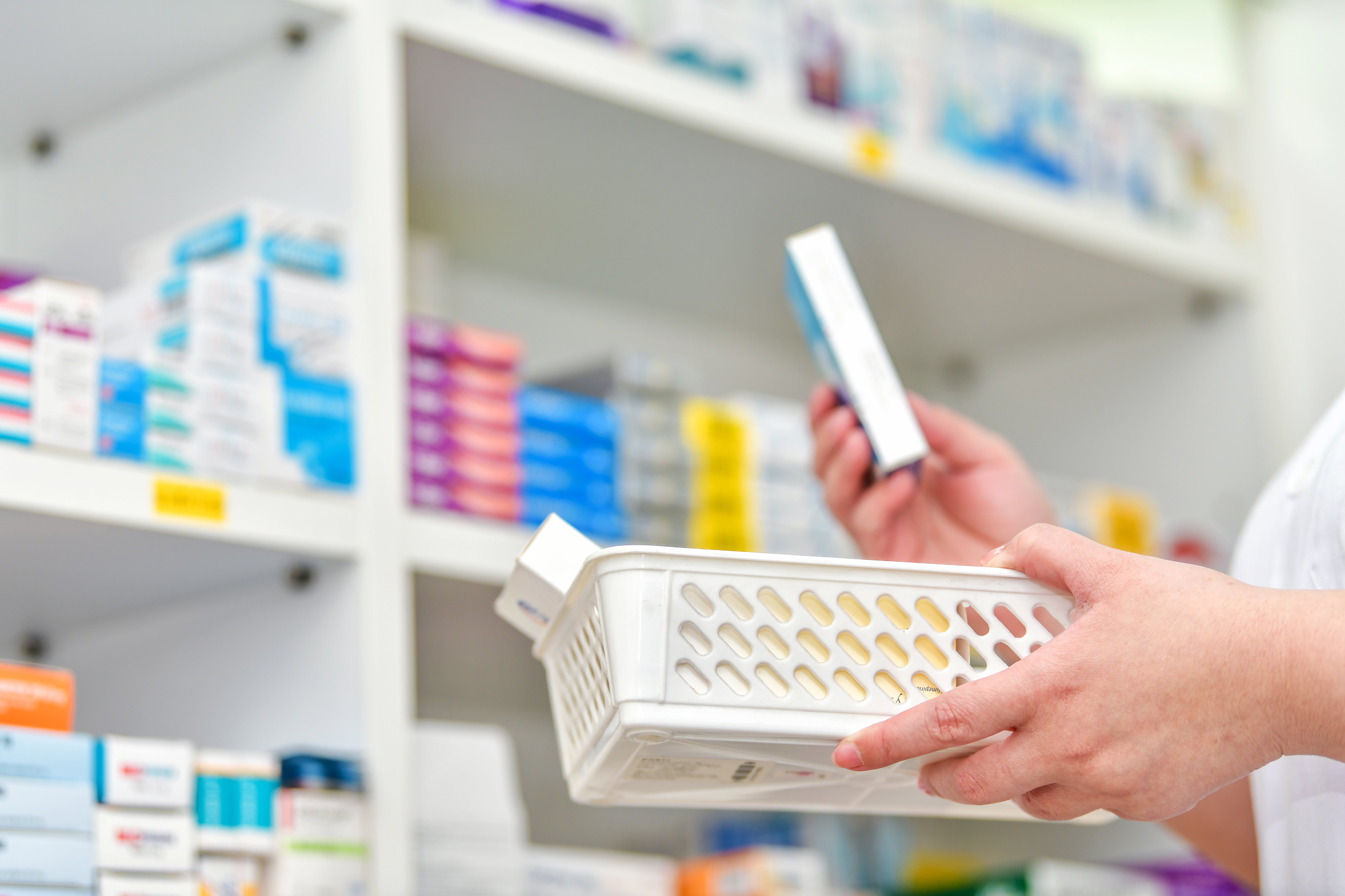 Pharmacist choosing medicine in pharmacy