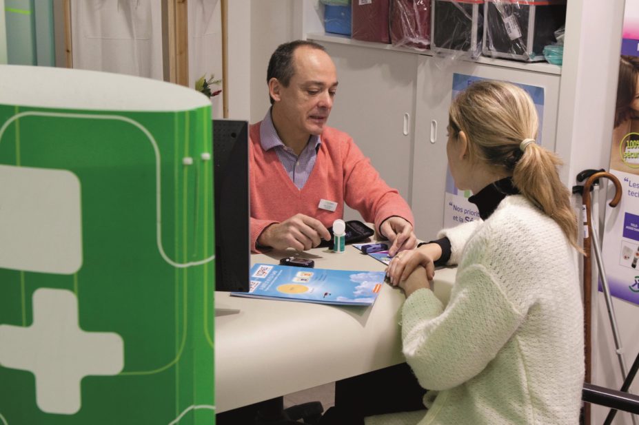 Pharmacist in consultation with patient