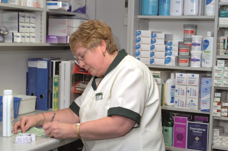 Community pharmacists should be given read and write access to the health records of palliative care patients to reduce delays in receiving medicines, says the Royal Pharmaceutical Society (RPS) Scotland. In the image, pharmacist prepares a prescription