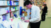 Pharmacist dispensing medicines in a pharmacy