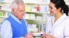 pharmacist helping older patient