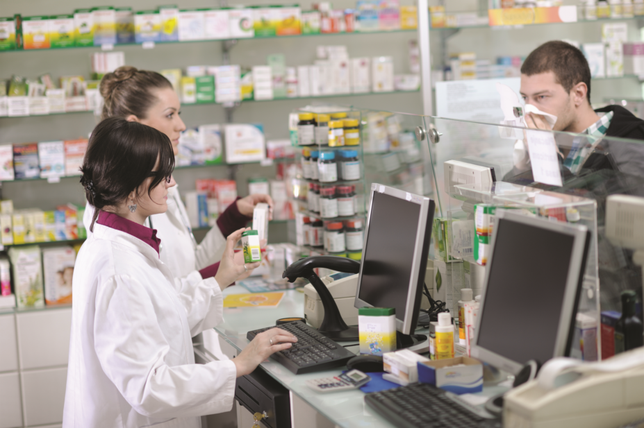 pharmacist helping patient with medicines literacy