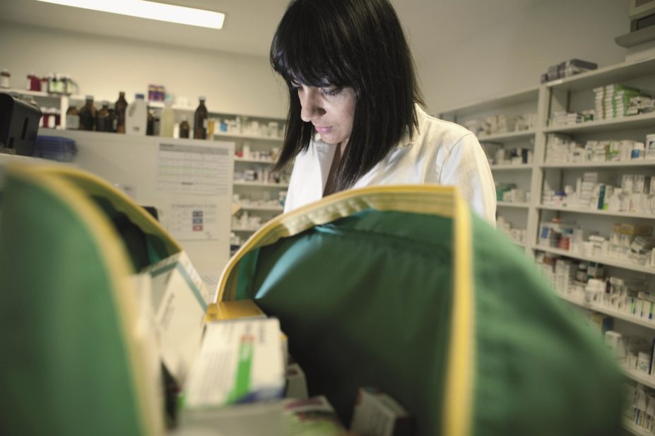The curriculum for pharmacy technicians is out of date and needs to change to reflect the increased role they play in community and hospitals, according to a the GPhC. In the image, a pharmacy technician packs a medication bag