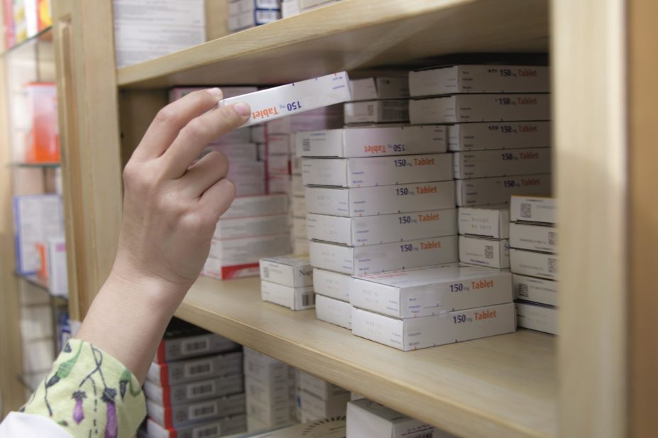 Antibiotic exposure could increase the risk of developing type 2 diabetes, say researchers. In the image, a pharmacist takes medicine from a shelf