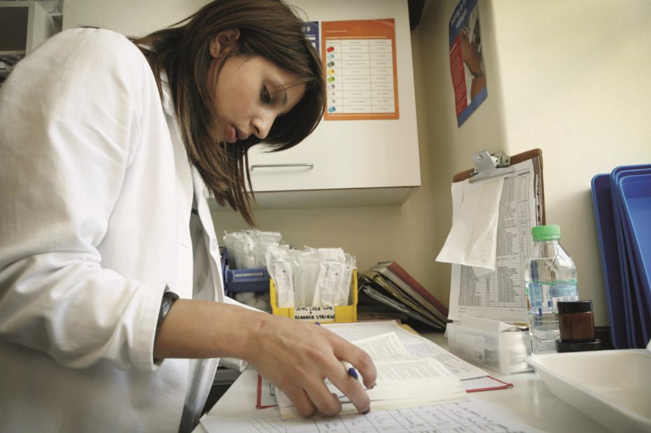 Patients can benefit when the healthcare service embraces new ways of working that address clinical need and changing demands, particularly when high risk medicines or patients are involved. In the image, a pharmacist checks patient records