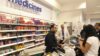 Pharmacists who work at Boots will have a maximum salary increase of 1.5% under the company’s new pay review system. In the image, Boots pharmacists at the store's medicines counter