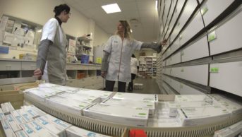 Pharmacists talking in a dispensary