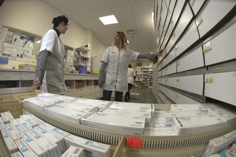 Pharmacists talking in a dispensary