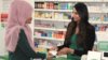 Pharmacist Nadia Bukhari speaks to a patient