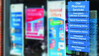 Storefront showing pharmacy services