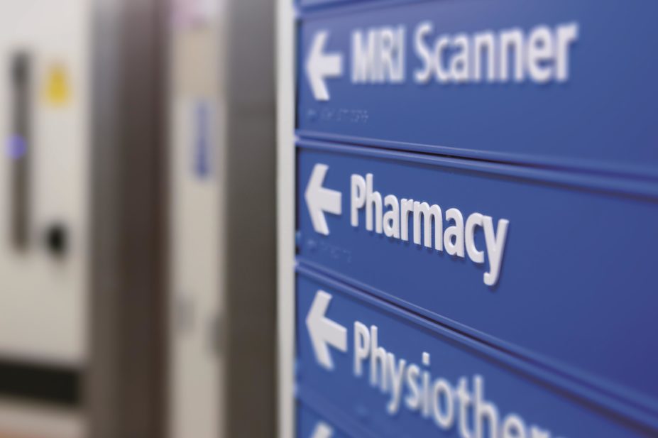 The types of services offered by pharmacies within the NHS are expanding, which means that all members of the pharmacy team need to attain new competencies and skills.. In the image, a close up of a pharmacy sign in a hospital