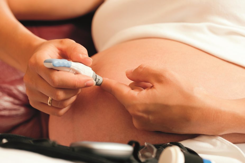 Pregnant woman taking glucose test
