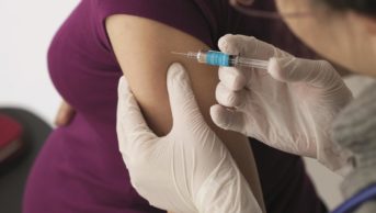 Pregnant woman receives flu vaccine