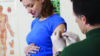 Pregnant woman receives vaccination