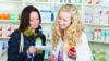 patient looking at prescription with pharmacist
